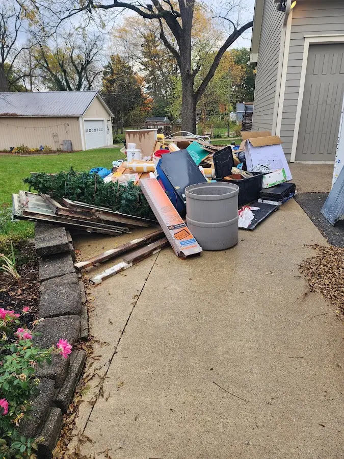 Dumpster being loaded with debris for Residential Dumpster Rental in Addison